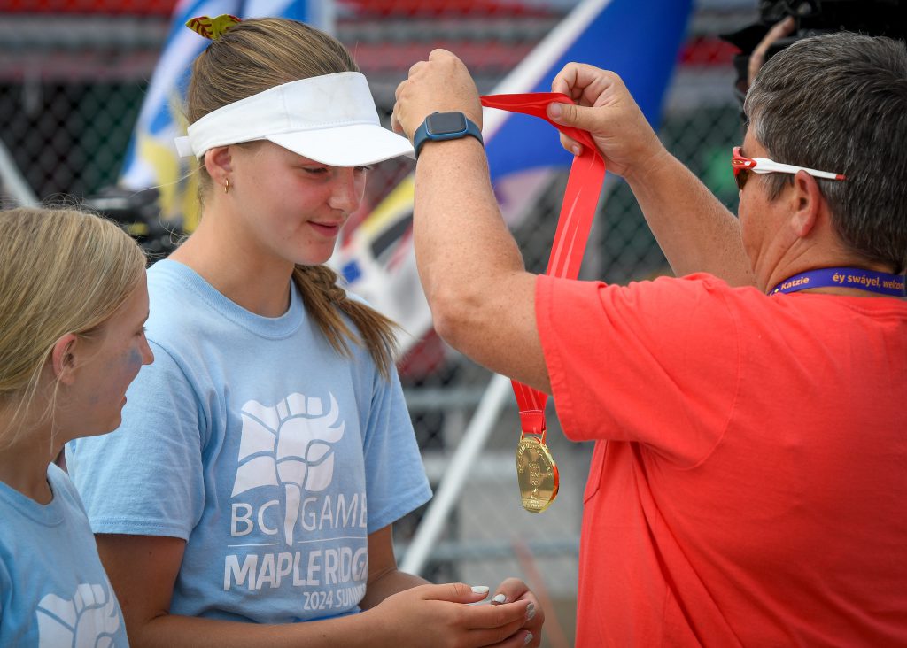 Deschanel Donovan receives gold medal.